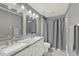 Modern bathroom featuring double sinks with marble countertops and updated fixtures at 2776 Joseph Cir, Oviedo, FL 32765