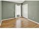 Spacious bedroom with wood floors, light green walls, and a double door closet at 2776 Joseph Cir, Oviedo, FL 32765