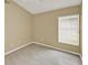 Bright bedroom with wood-look floors, a large window, and neutral paint at 2776 Joseph Cir, Oviedo, FL 32765