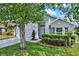 Stylish home featuring well-maintained landscaping and a two-car garage, framed by a lush, green lawn at 2776 Joseph Cir, Oviedo, FL 32765