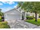 Charming single Gathering home with a two-car garage and well-manicured landscaping at 2776 Joseph Cir, Oviedo, FL 32765