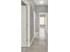 Hallway featuring wood look tile floor and light gray walls with white trim at 2776 Joseph Cir, Oviedo, FL 32765