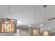 Modern decorative light fixtures above a kitchen island, providing both style and illumination at 2776 Joseph Cir, Oviedo, FL 32765