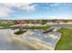 Scenic aerial view of a lake with a boat dock and surrounding neighborhood at 2801 Boat Cove Cir, Kissimmee, FL 34746