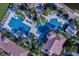 Aerial view showcasing multiple community pools, lush landscaping, and sunbathing areas at 2801 Boat Cove Cir, Kissimmee, FL 34746