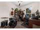 Cozy bedroom with built-in bookshelves, desk, and music instruments for a creative space at 2801 Boat Cove Cir, Kissimmee, FL 34746