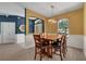 Comfortable dining room featuring a wooden table with seating for six and modern lighting at 2801 Boat Cove Cir, Kissimmee, FL 34746