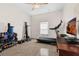 Carpeted exercise room with exercise equipment, ceiling fan, and neutral paint at 2801 Boat Cove Cir, Kissimmee, FL 34746