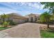 Charming single-story home featuring a tile roof, manicured landscaping, and a spacious three-car garage at 2801 Boat Cove Cir, Kissimmee, FL 34746