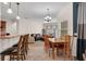 Open concept kitchen and living area with natural lighting and ceiling fans at 2801 Boat Cove Cir, Kissimmee, FL 34746