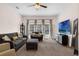 Bright and airy living room with comfortable seating and large windows overlooking the lush outdoor scenery at 2801 Boat Cove Cir, Kissimmee, FL 34746