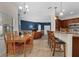 Open floor plan with bar seating and view to the Gathering room at 2801 Boat Cove Cir, Kissimmee, FL 34746