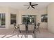 Covered patio featuring a stylish outdoor dining set, ideal for enjoying meals and gatherings in the shade at 2801 Boat Cove Cir, Kissimmee, FL 34746