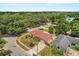 Enjoy this stunning aerial view of this charming property nestled among lush trees in a desirable neighborhood at 2933 N Chickasaw Trl, Orlando, FL 32817