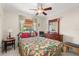 Comfortable bedroom featuring a ceiling fan and view of the outdoors at 2933 N Chickasaw Trl, Orlando, FL 32817