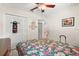 Bright bedroom featuring tile flooring, spacious closet, and natural light at 2933 N Chickasaw Trl, Orlando, FL 32817