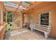 Inviting front porch with brick flooring and a cozy seating area at 2933 N Chickasaw Trl, Orlando, FL 32817