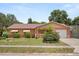 Charming single-story home with a well-maintained front yard and attached garage at 2933 N Chickasaw Trl, Orlando, FL 32817