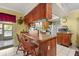 Functional kitchen featuring a breakfast bar and essential appliances at 2933 N Chickasaw Trl, Orlando, FL 32817