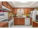 Well-equipped kitchen with wood cabinets and ample counter space at 2933 N Chickasaw Trl, Orlando, FL 32817