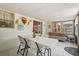 Inviting sunroom featuring tile flooring, comfortable seating, and abundant natural light with outdoor access at 2933 N Chickasaw Trl, Orlando, FL 32817