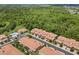 Aerial view of community showcasing the pool and surrounding mature trees at 299 Terracina Dr, Sanford, FL 32771