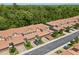 Spacious townhouses boasting clay tile roofing with lush green surroundings and tree coverage at 299 Terracina Dr, Sanford, FL 32771