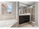 Bathroom with tile flooring, soaking tub, glass shower, and double sink vanity at 299 Terracina Dr, Sanford, FL 32771