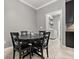 Cozy breakfast nook with black table and chairs, and convenient access to the laundry room at 299 Terracina Dr, Sanford, FL 32771