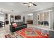Open-concept living room offers tile floors and open access to kitchen and dining areas at 299 Terracina Dr, Sanford, FL 32771