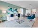 Bright living room featuring a modern sofa, glass coffee table, and stylish decor at 3635 Fort Mellon Ln, Sanford, FL 32773
