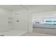 Bright bathroom showcasing a tiled shower and view into the bedroom at 3665 Marlberry Way, Sanford, FL 32773