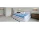 Well-lit bedroom with a soft color palette, plush bedding, and ample space, perfect for relaxation at 3665 Marlberry Way, Sanford, FL 32773