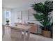 Bright home office with a modern desk, ample natural light, and stylish decor at 3665 Marlberry Way, Sanford, FL 32773