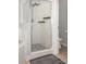 Bathroom with clear glass shower and dark stone tiles at 400 Bridge Creek Blvd, Ocoee, FL 34761