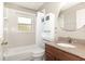 The bathroom features a sink, toilet, bathtub, and vanity at 400 Bridge Creek Blvd, Ocoee, FL 34761