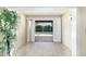 Bright foyer with view of the pool beyond sliding glass doors at 400 Bridge Creek Blvd, Ocoee, FL 34761