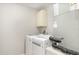 A laundry room with a white washer and dryer at 400 Bridge Creek Blvd, Ocoee, FL 34761