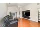 Spacious living room with vaulted ceilings, hardwood floors, and a modern entertainment center at 400 Bridge Creek Blvd, Ocoee, FL 34761