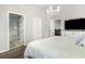 This main bedroom features a chandelier and ensuite bathroom at 400 Bridge Creek Blvd, Ocoee, FL 34761