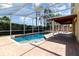 Large, screened-in pool and patio area with hot tub, ideal for outdoor enjoyment at 400 Bridge Creek Blvd, Ocoee, FL 34761