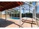Outdoor pool and spa area under a screened enclosure, perfect for relaxation at 400 Bridge Creek Blvd, Ocoee, FL 34761