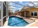 Covered patio and outdoor pool with hot tub, creating a great entertainment space at 400 Bridge Creek Blvd, Ocoee, FL 34761
