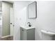This bathroom offers a modern vanity, mirror, and toilet at 43 Lake Court Loop, Ocala, FL 34472