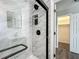 Modern bathroom with marble tile shower, sleek fixtures, and glass door at 43 Lake Court Loop, Ocala, FL 34472
