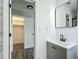 This bathroom features a modern vanity, mirror, and fixtures at 43 Lake Court Loop, Ocala, FL 34472