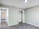 This bedroom offers hard surface floors, neutral paint, and a closet at 43 Lake Court Loop, Ocala, FL 34472