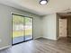Neutral bedroom with sliding glass door and natural light at 43 Lake Court Loop, Ocala, FL 34472