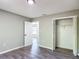 This bedroom boasts hard surface floors, neutral paint, and a closet at 43 Lake Court Loop, Ocala, FL 34472