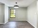 This dining room features hard surface floors, neutral paint, and a window at 43 Lake Court Loop, Ocala, FL 34472